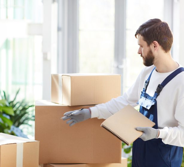 moving-manager-examining-packages.jpg