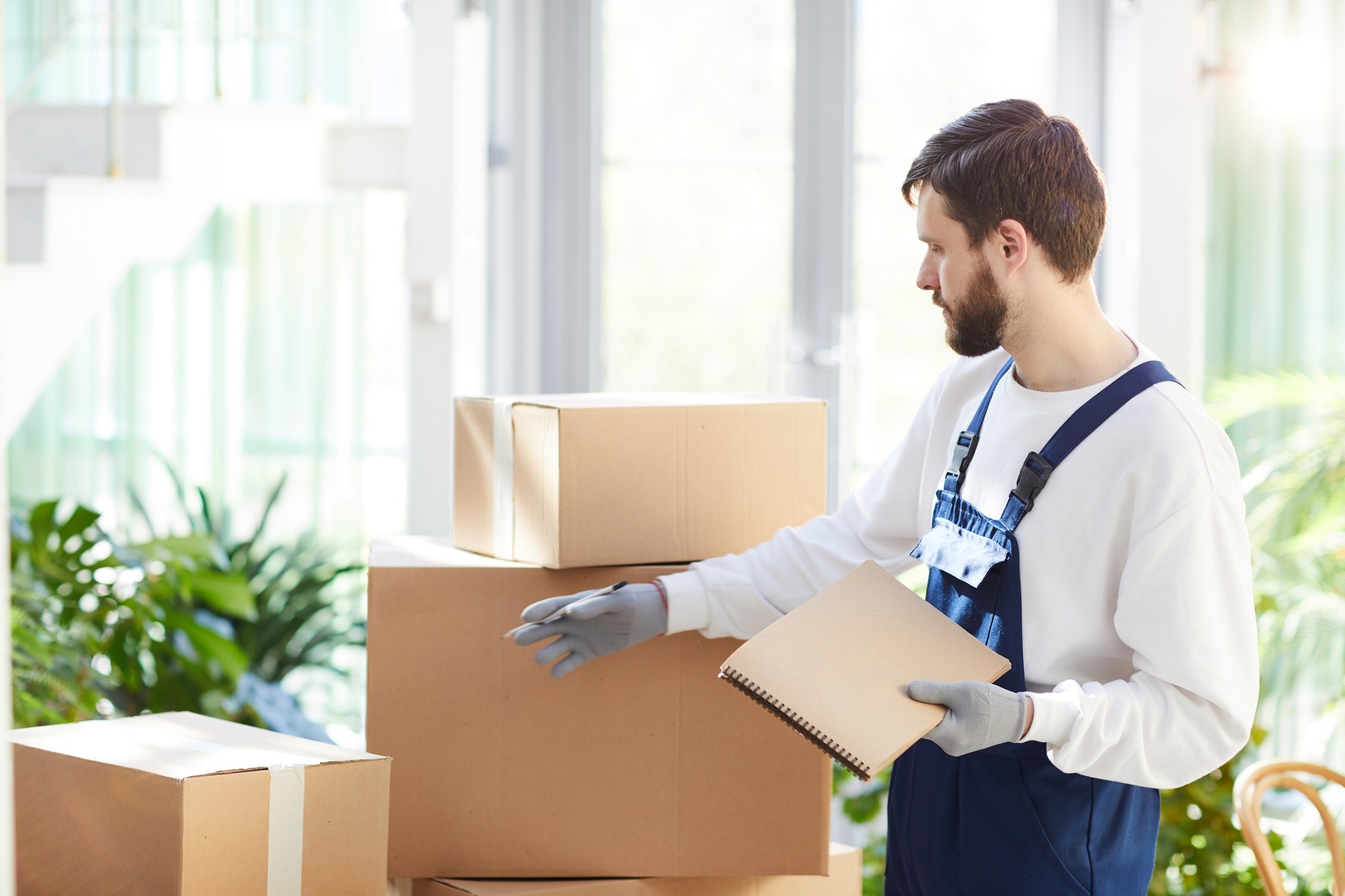 moving-manager-examining-packages.jpg